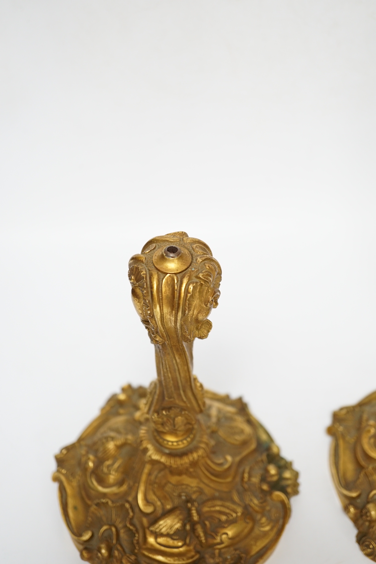 A pair of French ormolu candlesticks, one detached sconce, 30cm